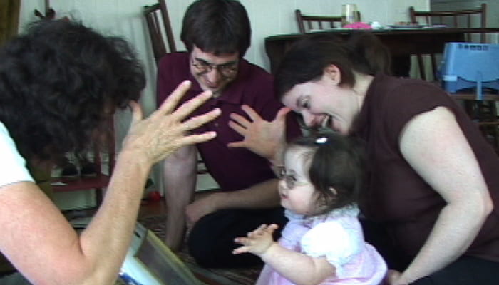 Woman signing with child