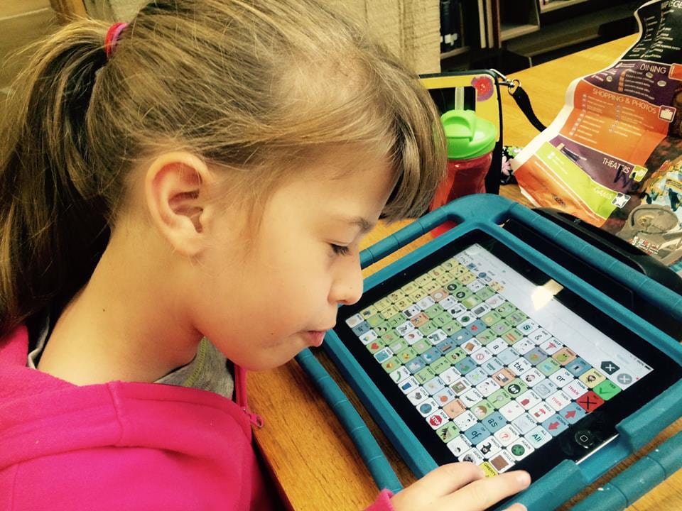 child with AAC device