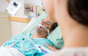 man in hospital bed