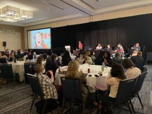 Summitt attendees listening to presenter
